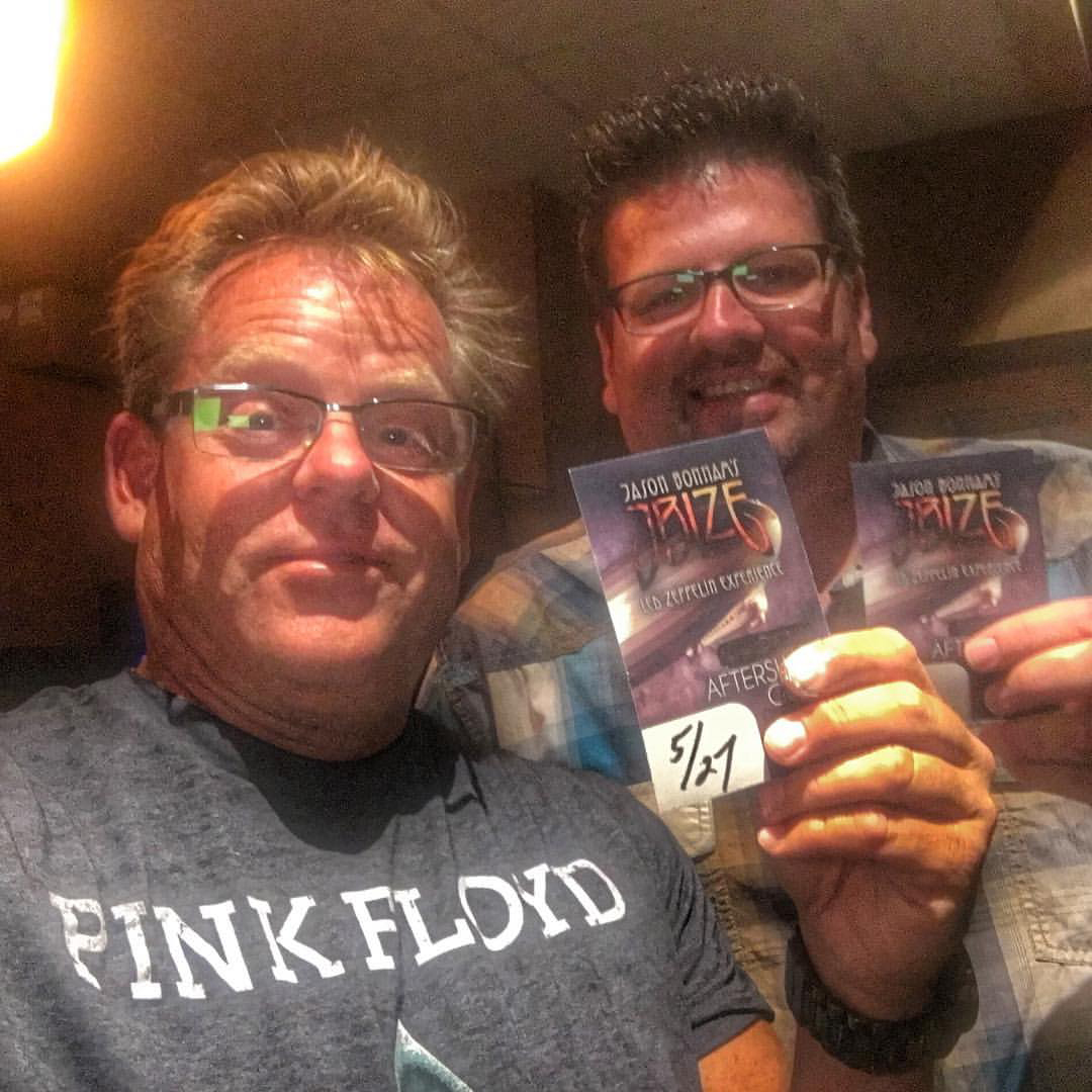 Gary Woodward and Michael Zippidy Duda together holding event passes