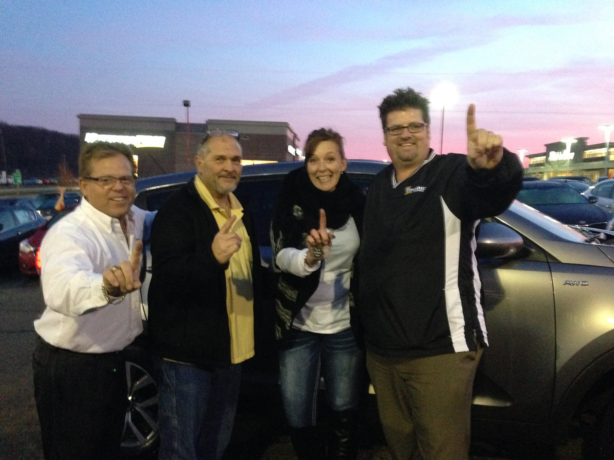 Celebrating a number one automotive delivery moment at dusk